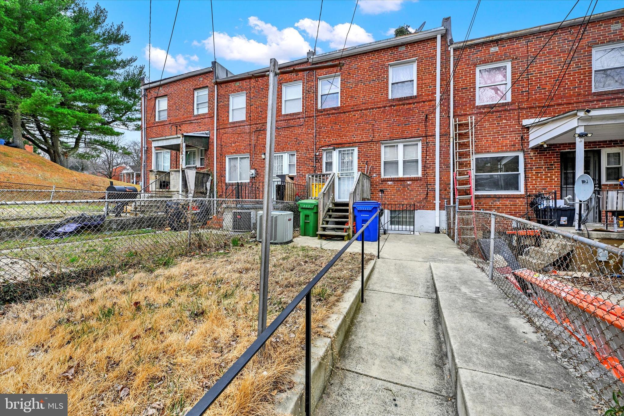 517 Random Road Baltimore, MD 21229 - Photo 12 of 13 a view of a brick building with many windows