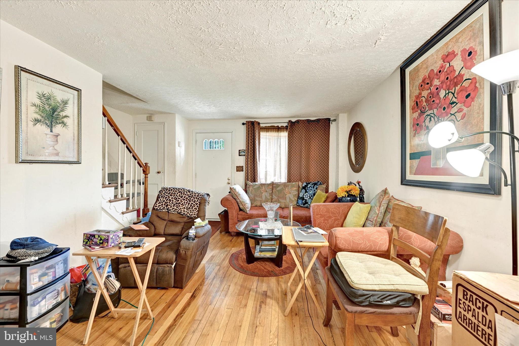 517 Random Road Baltimore, MD 21229 - Photo 2 of 13 a living room with furniture and wooden floor