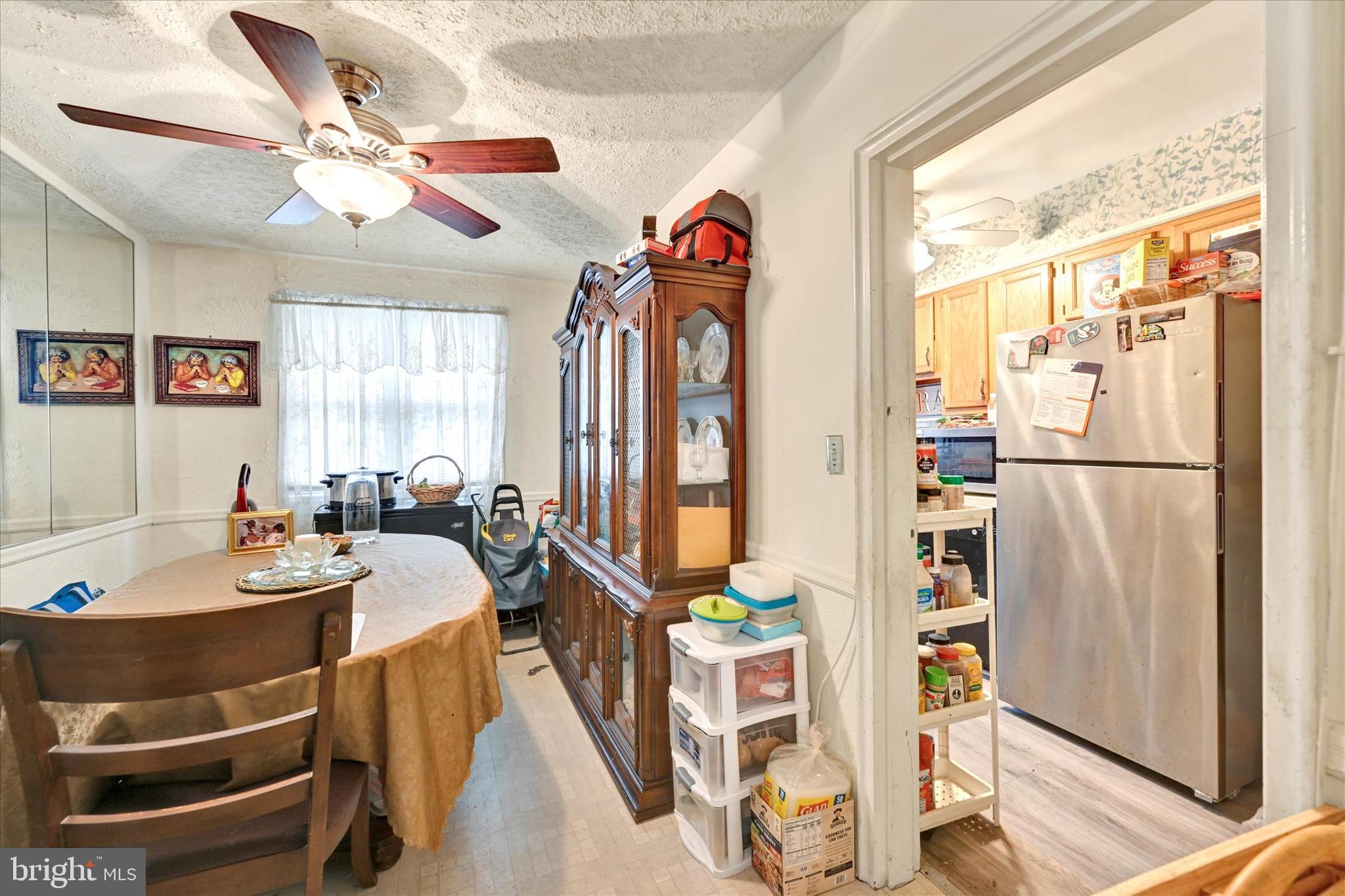 517 Random Road Baltimore, MD 21229 - Photo 7 of 13 a view of a dining room with furniture window and wooden floor
