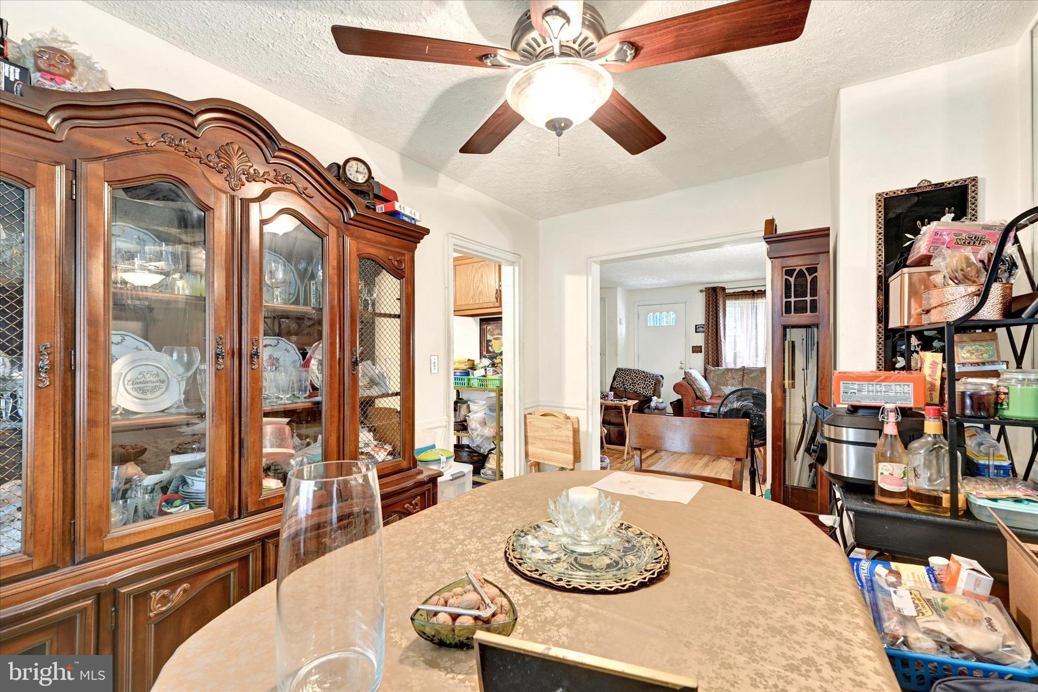 517 Random Road Baltimore, MD 21229 - Photo 8 of 13 a living room with furniture fireplace and a large window