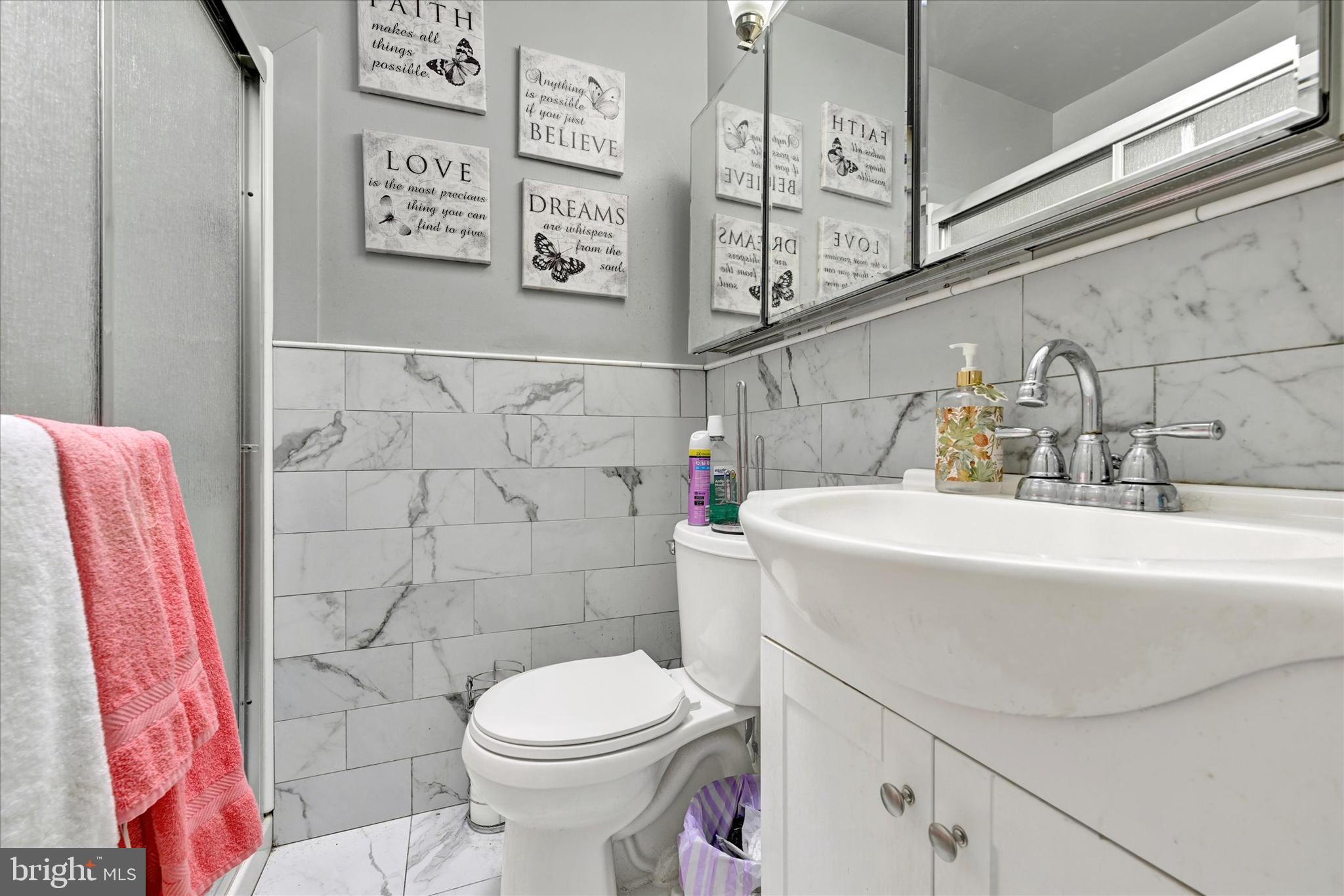 517 Random Road Baltimore, MD 21229 - Photo 9 of 13 a bathroom with a sink and a toilet