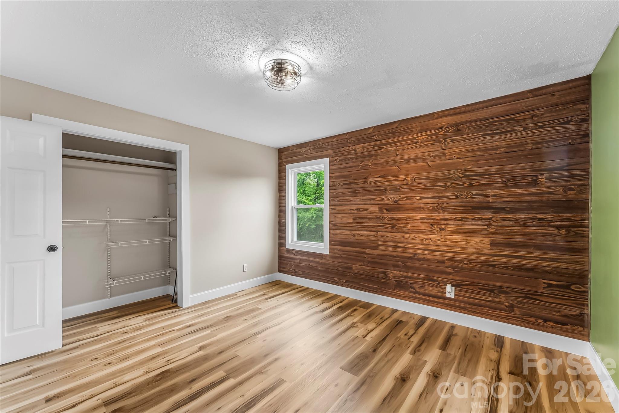 825 South Creek Road Nebo, NC 28761 - Photo 23 of 34 a view of an empty room with wooden floor and a window