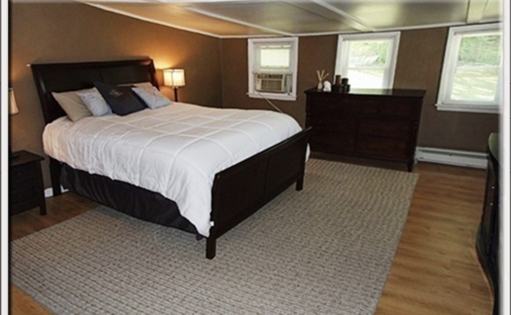 19 Simone Street Worcester, MA 01604 - Photo 11 of 14 a bedroom with a bed and a mirror