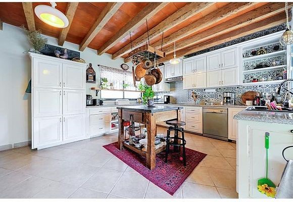 6 Rancho Los Labradores Vonore, TN 37885 - Photo 7 of 30 a kitchen with stainless steel appliances granite countertop a stove a sink and a microwave