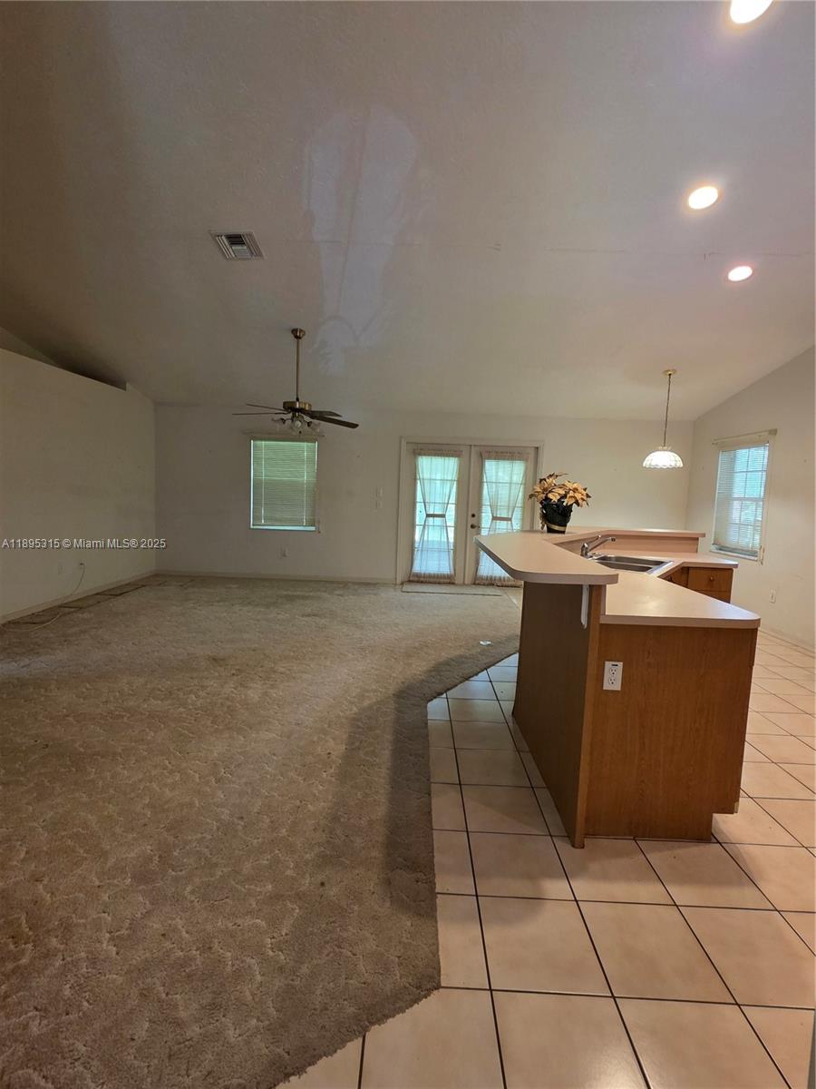 4802 Matanzas Avenue Fort Pierce, FL 34946 - Photo 16 of 28 a room with a table and chairs