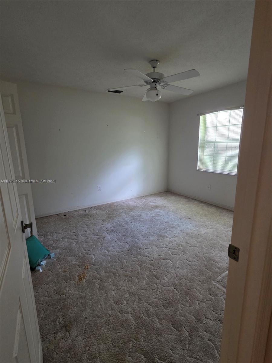 4802 Matanzas Avenue Fort Pierce, FL 34946 - Photo 18 of 28 an empty room with windows