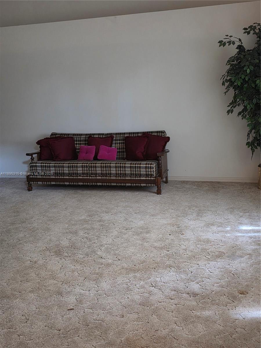 4802 Matanzas Avenue Fort Pierce, FL 34946 - Photo 2 of 28 a room with a couch