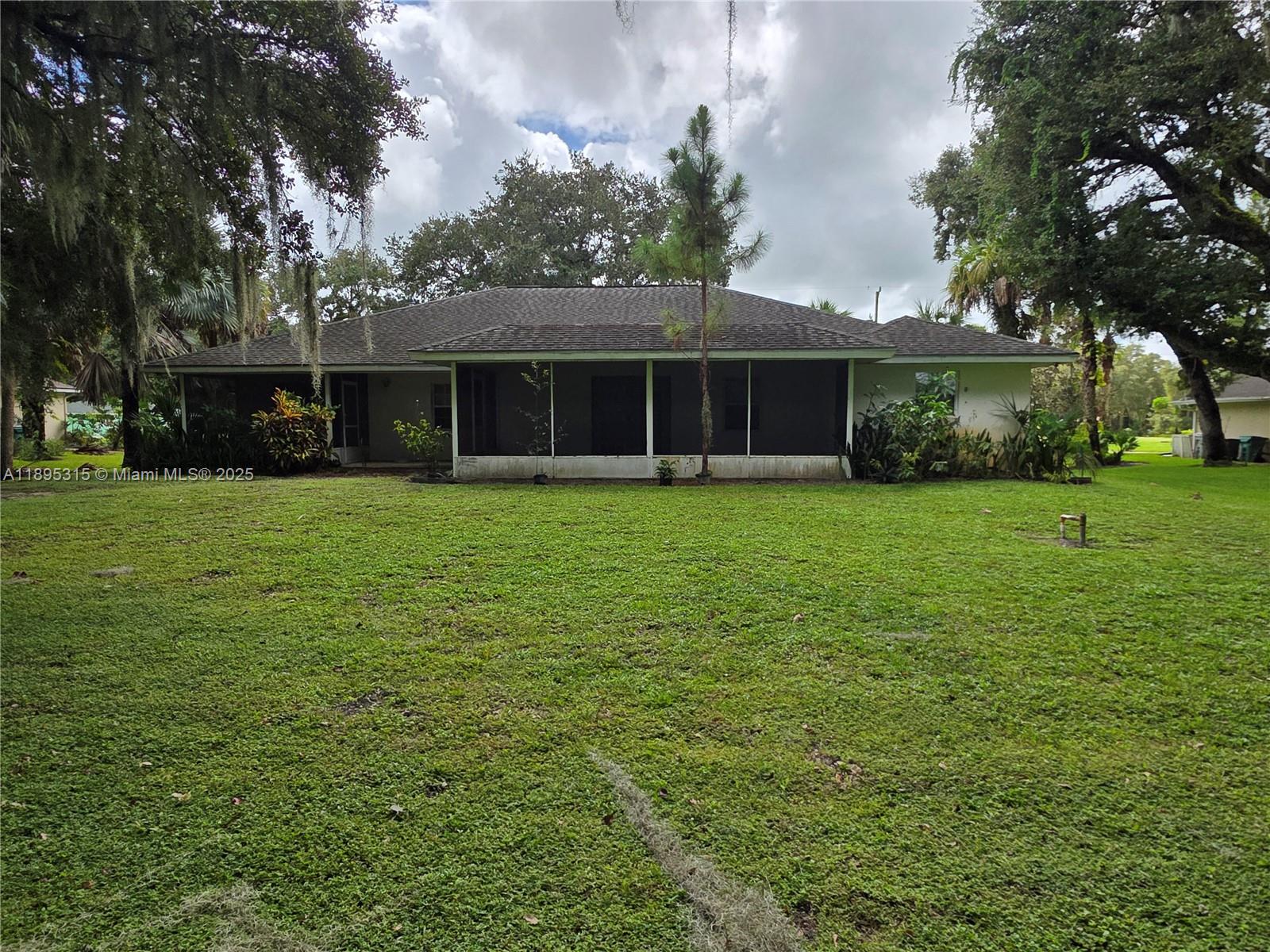 4802 Matanzas Avenue Fort Pierce, FL 34946 - Photo 23 of 28 front view of a house with a yard