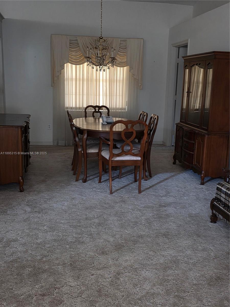 4802 Matanzas Avenue Fort Pierce, FL 34946 - Photo 3 of 28 a view of a dining room with furniture window and outside view