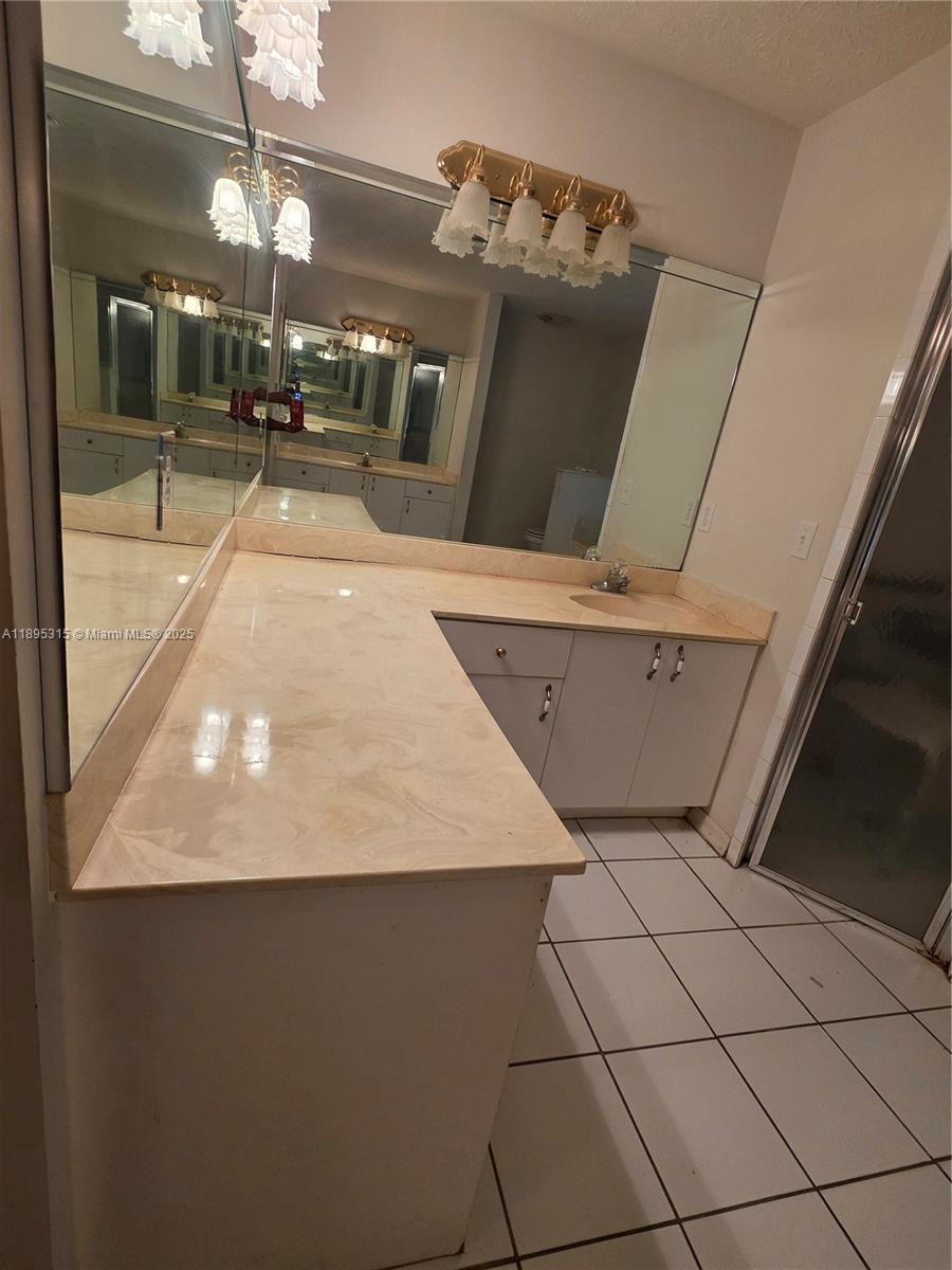 4802 Matanzas Avenue Fort Pierce, FL 34946 - Photo 9 of 28 a view of a living room with furniture and a floor to ceiling window