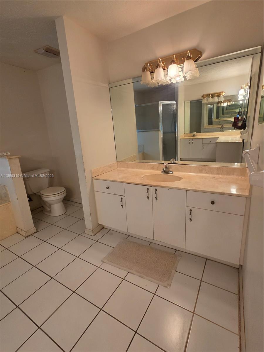 4802 Matanzas Avenue Fort Pierce, FL 34946 - Photo 10 of 28 a bathroom with a sink and a mirror