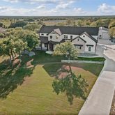 an aerial view of a house with a garden