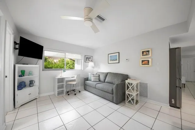 a kitchen with white cabinets stainless steel appliances and sink