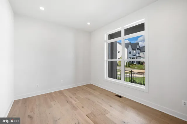 a view of a kitchen with a sink and a large window
