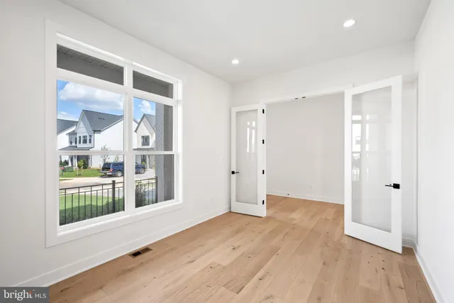 a bathroom with a tub sink shower and mirror