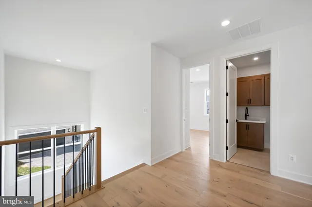 a view of an entryway with wooden floor