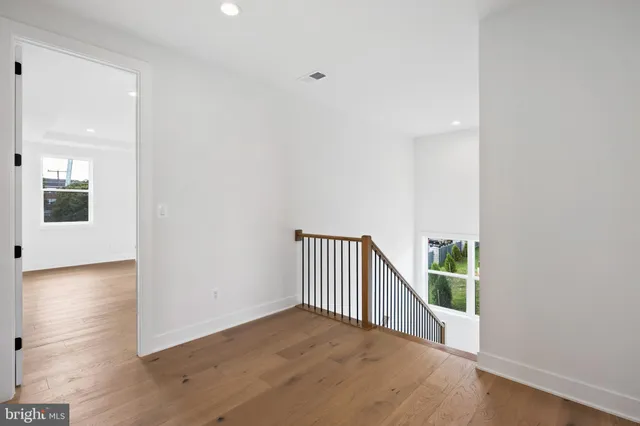 a bathroom with a tub a sink and glass door shower