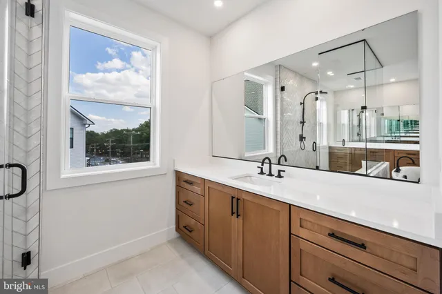 a view of a livingroom with wooden floor and a fireplace