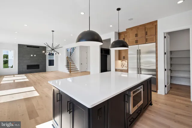 a kitchen with stainless steel appliances granite countertop a stove and a sink