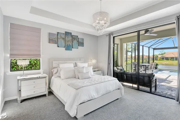 a bedroom with bed and a large window