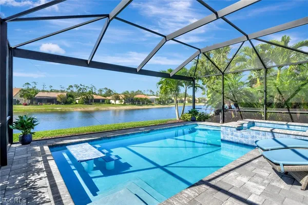 a view of swimming pool with a patio
