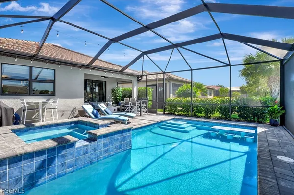 a view of swimming pool with a patio and a yard