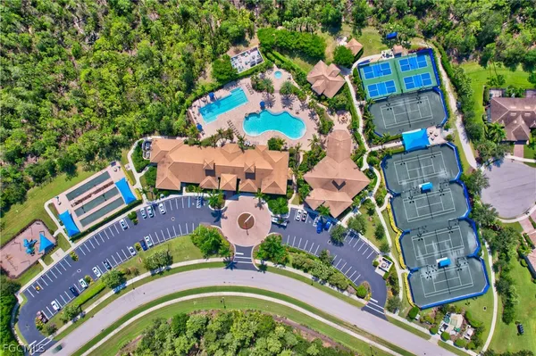 an aerial view of a houses with yard