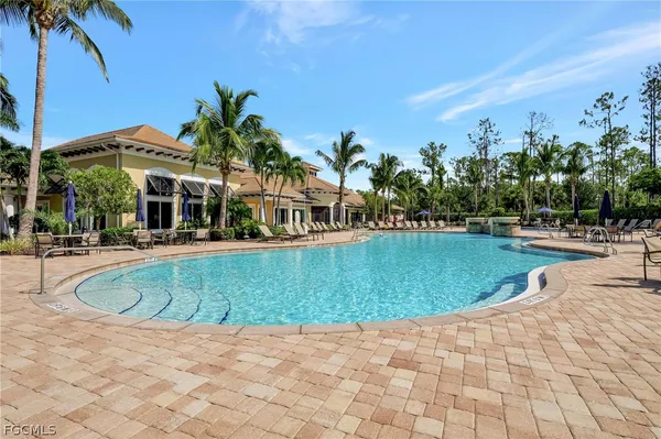 a view of swimming pool with outdoor seating