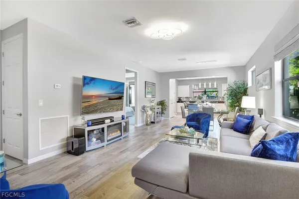 a living room with furniture and a flat screen tv