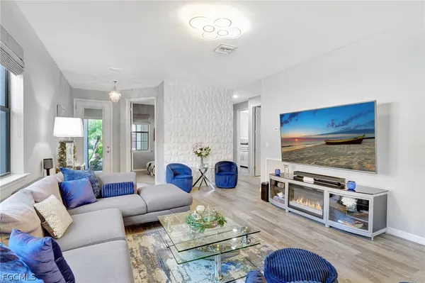 a living room with furniture and a flat screen tv