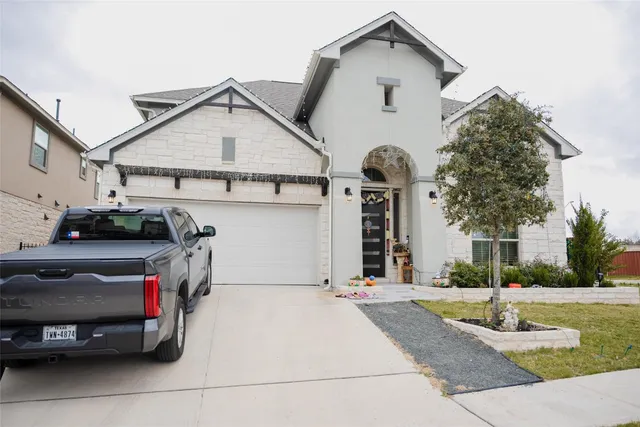 a view of a car park in front of house