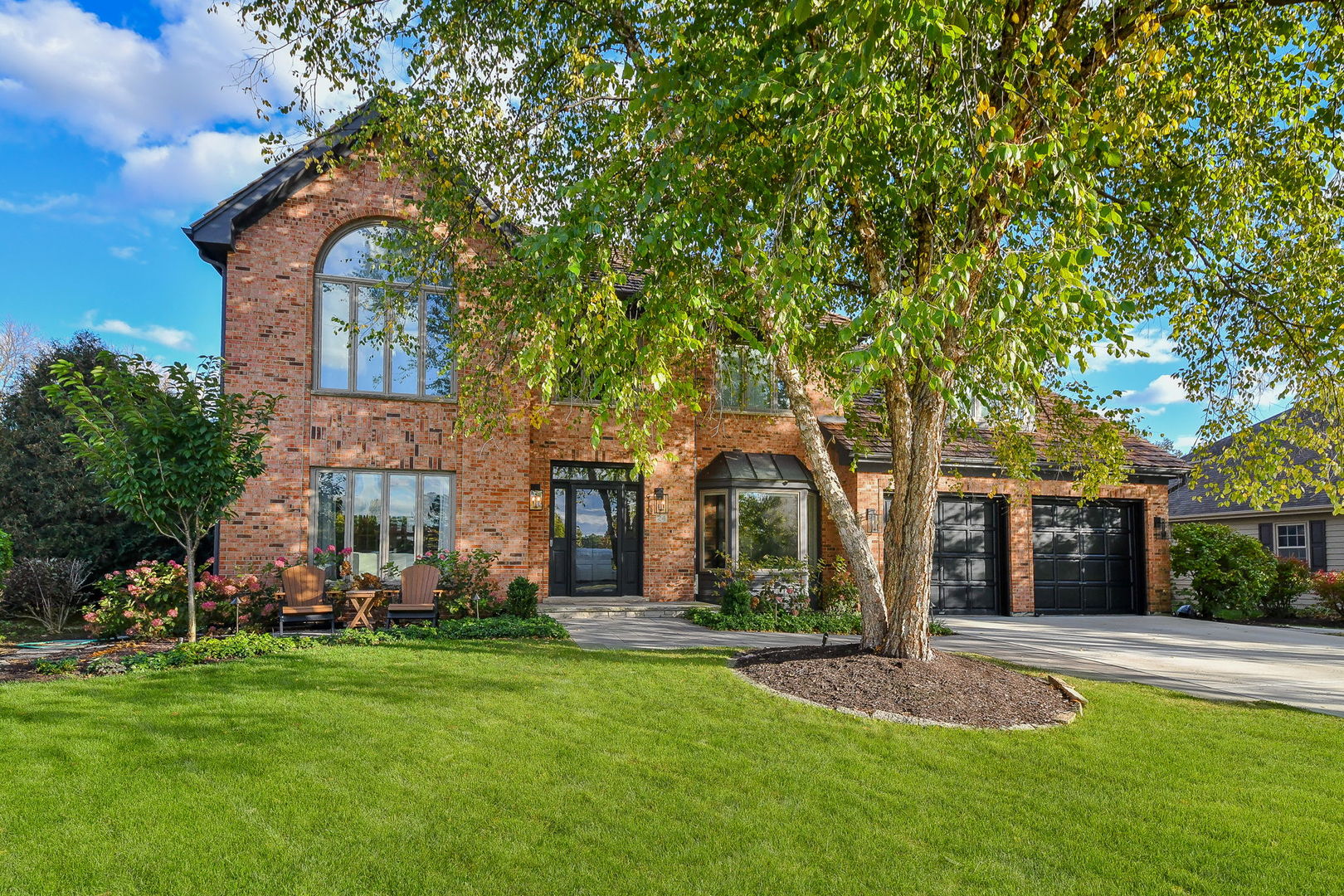 front view of a house with a yard