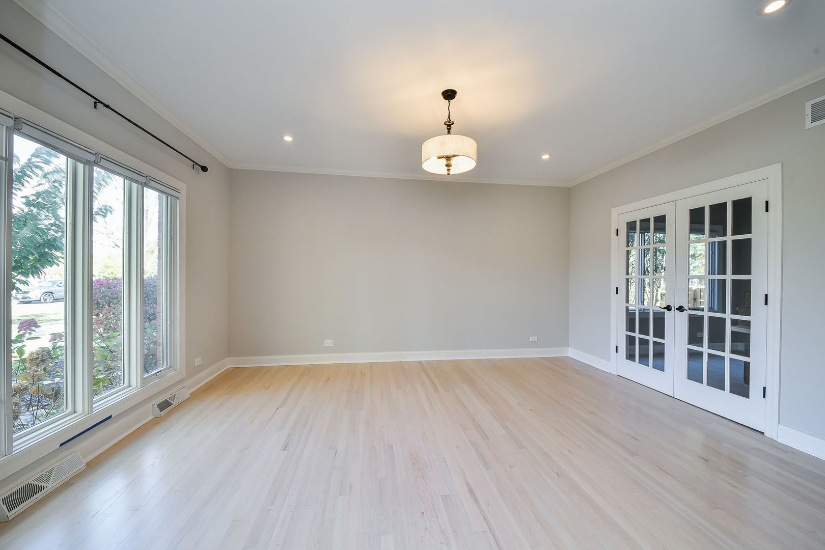 24 Winners Cup Circle Wheaton, IL 60189 - Photo 13 of 46 an empty room with wooden floor and windows