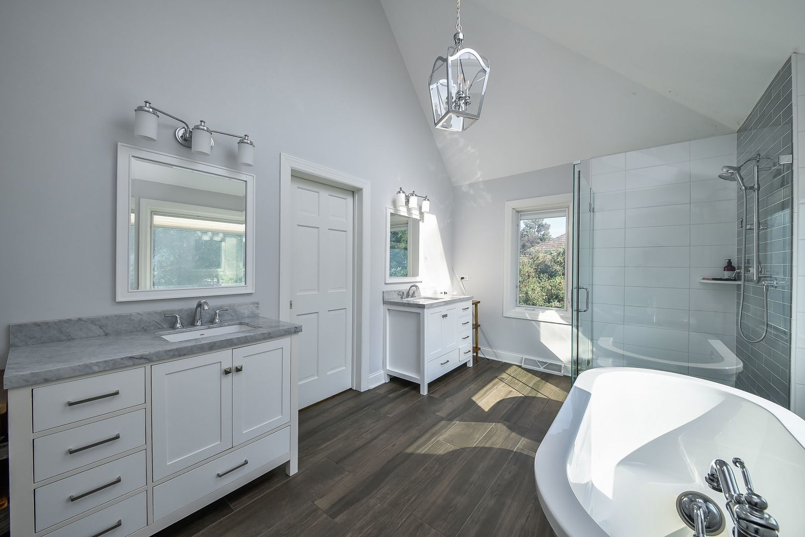 24 Winners Cup Circle Wheaton, IL 60189 - Photo 23 of 46 a spacious bathroom with a granite countertop sink a toilet a mirror and shower