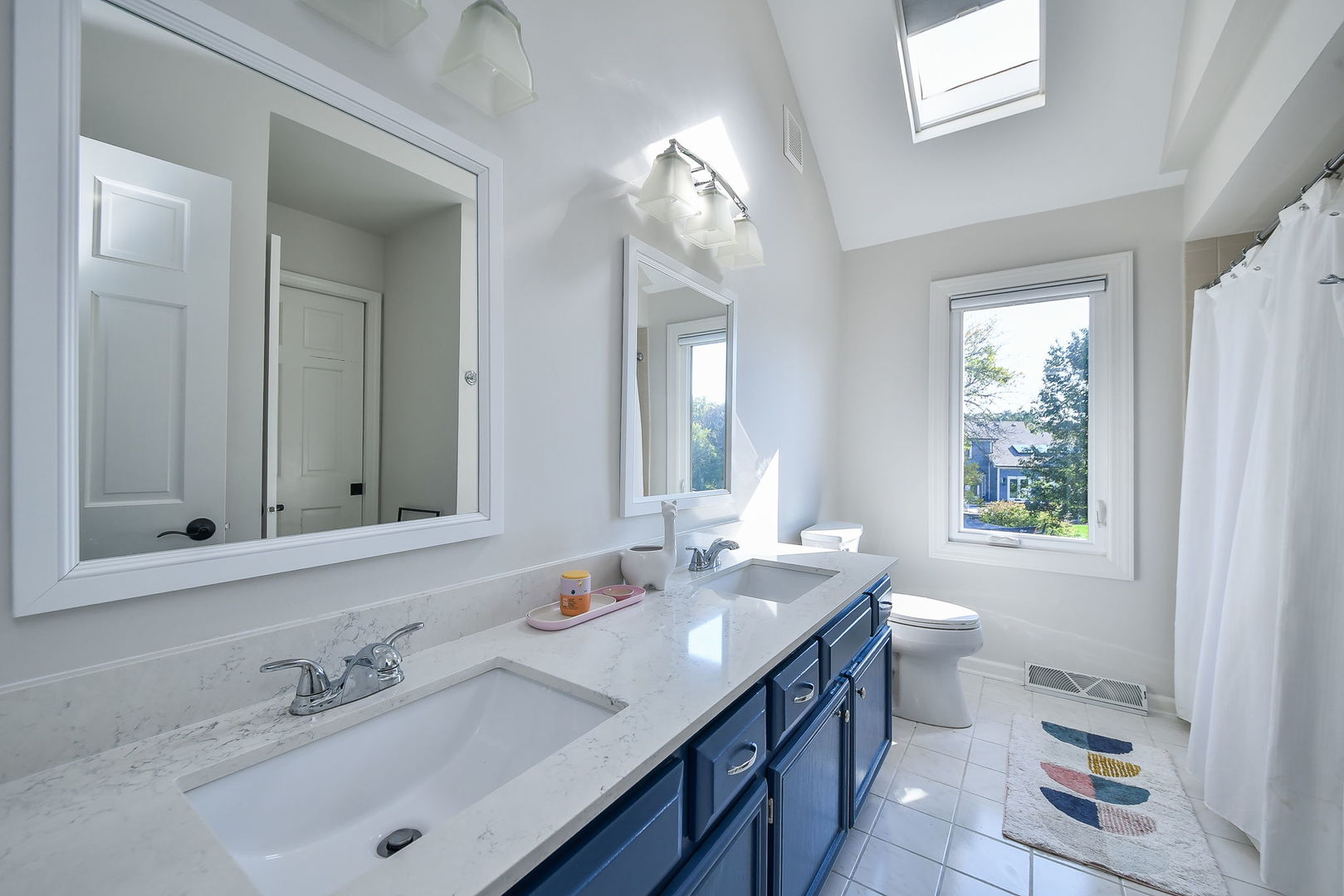 24 Winners Cup Circle Wheaton, IL 60189 - Photo 26 of 46 a bathroom with a sink double vanity granite and a mirror