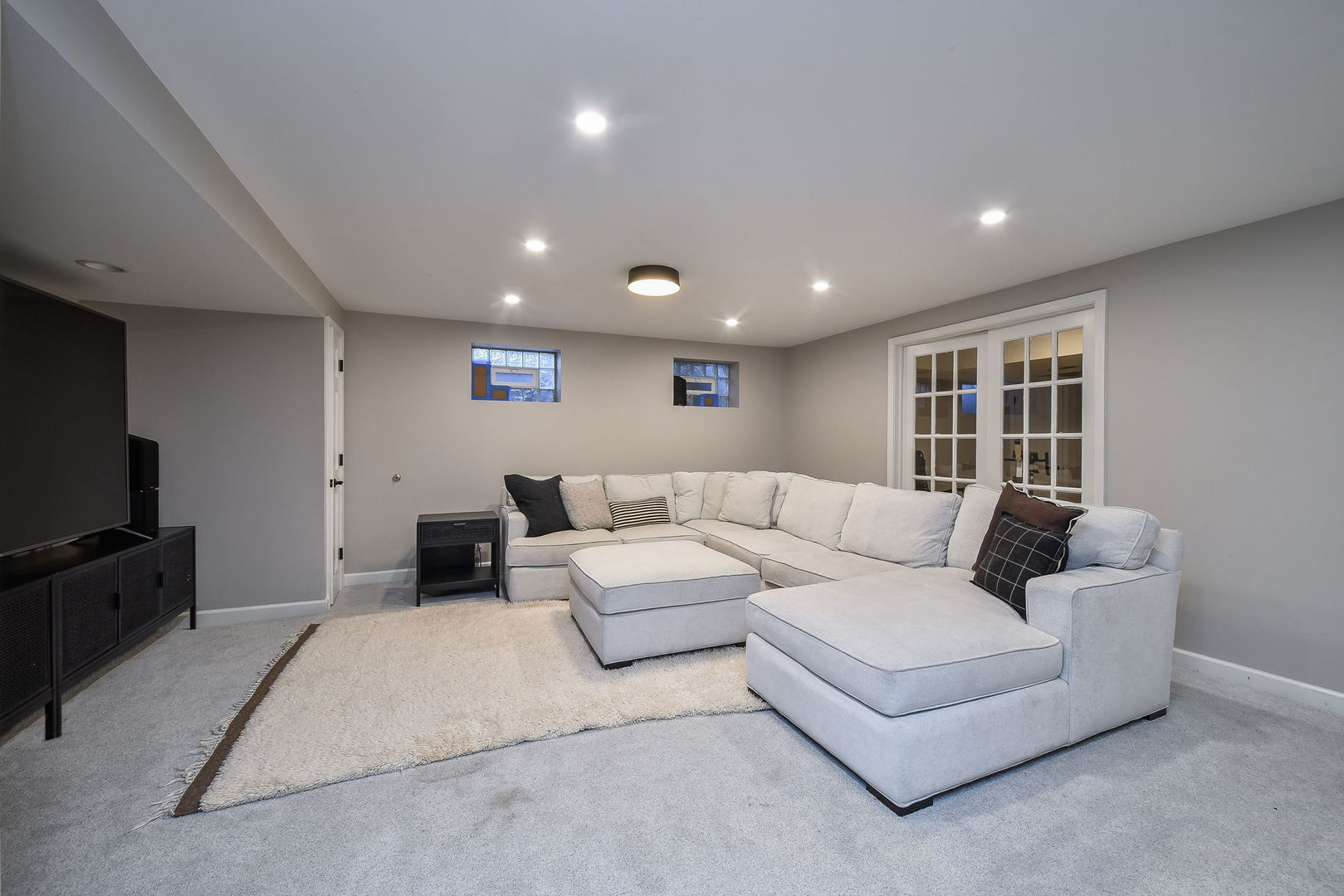 24 Winners Cup Circle Wheaton, IL 60189 - Photo 30 of 46 a living room with furniture and a flat screen tv