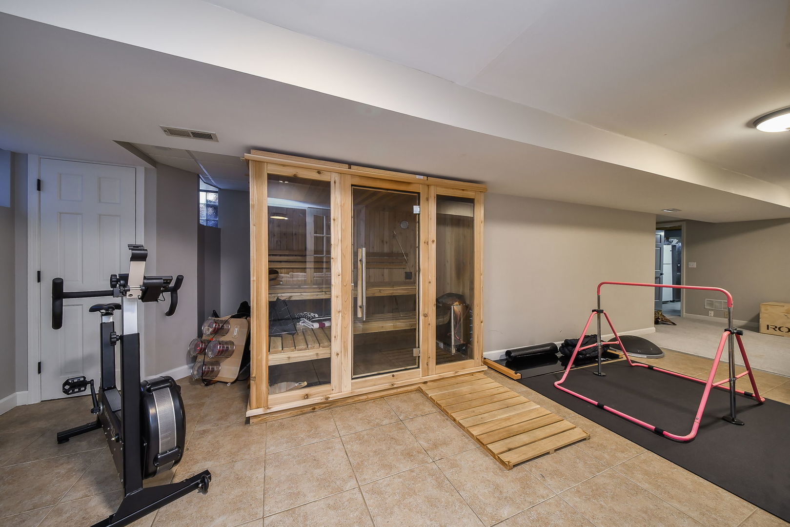 24 Winners Cup Circle Wheaton, IL 60189 - Photo 31 of 46 a room with gym equipment and a table