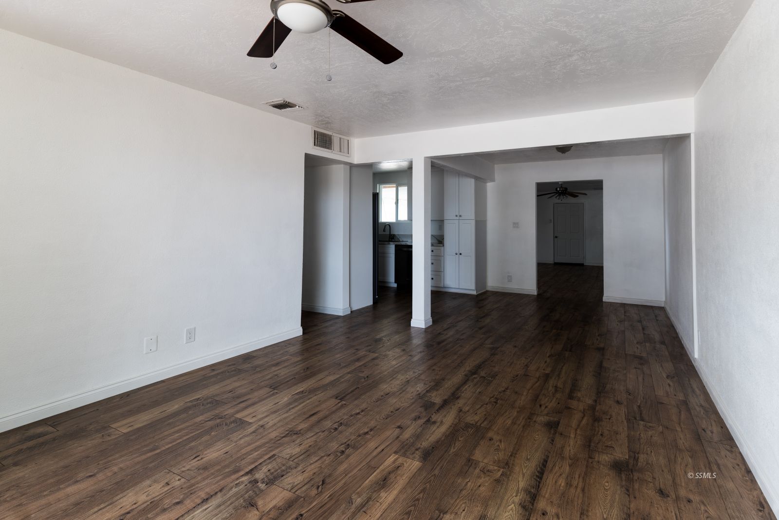 927 West Sullivan Avenue Ridgecrest, CA 93555 - Photo 6 of 24 wooden floor in a hall with an entryway
