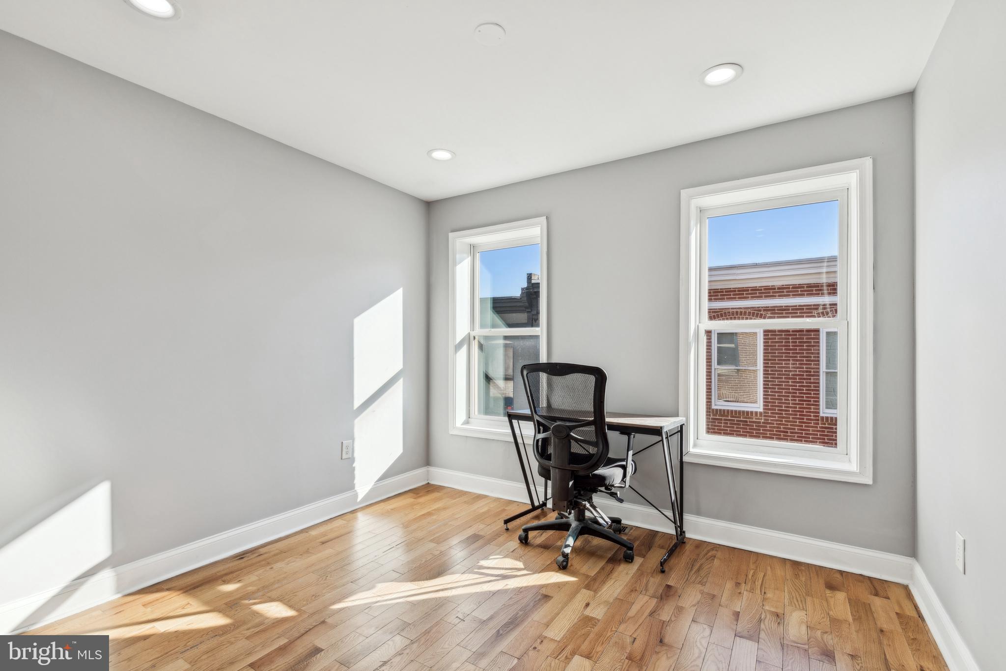 712 North Duncan Street Baltimore, MD 21205 - Photo 13 of 27 a view of workspace with wooden floor windows
