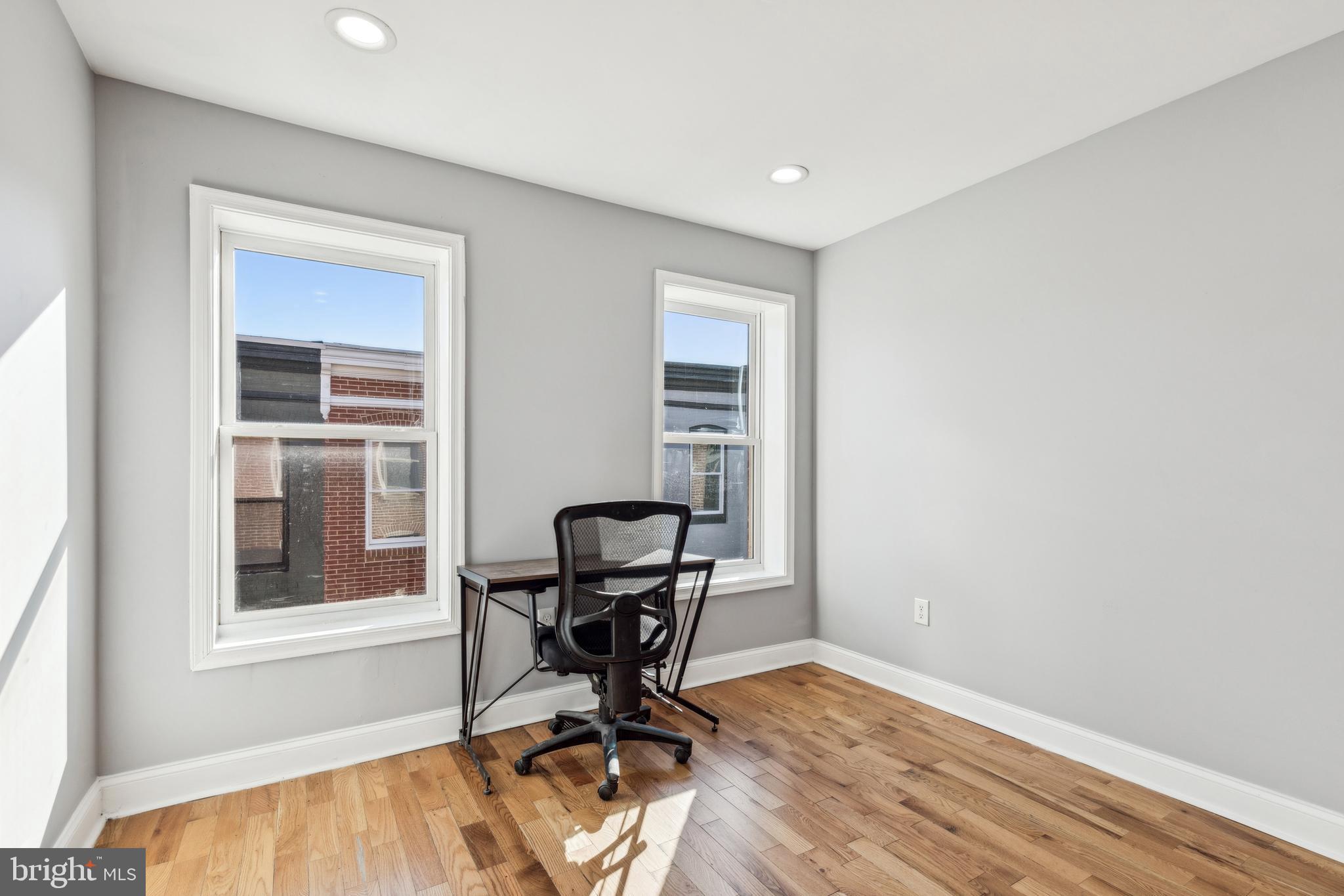 712 North Duncan Street Baltimore, MD 21205 - Photo 16 of 27 a view of a workspace with furniture and a window