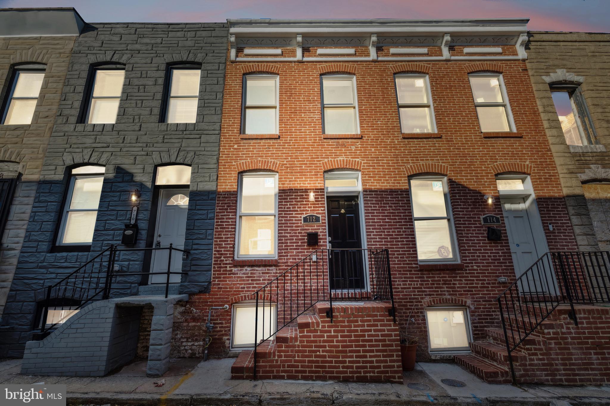 712 North Duncan Street Baltimore, MD 21205 - Photo 2 of 27 a front view of a building with glass windows