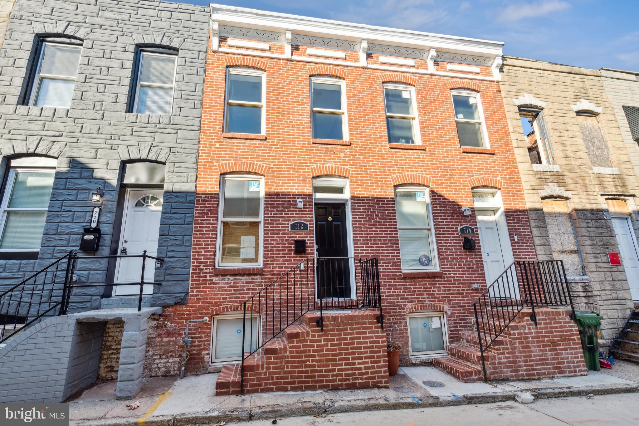 712 North Duncan Street Baltimore, MD 21205 - Photo 5 of 27 aerial view of a brick building next to a yard