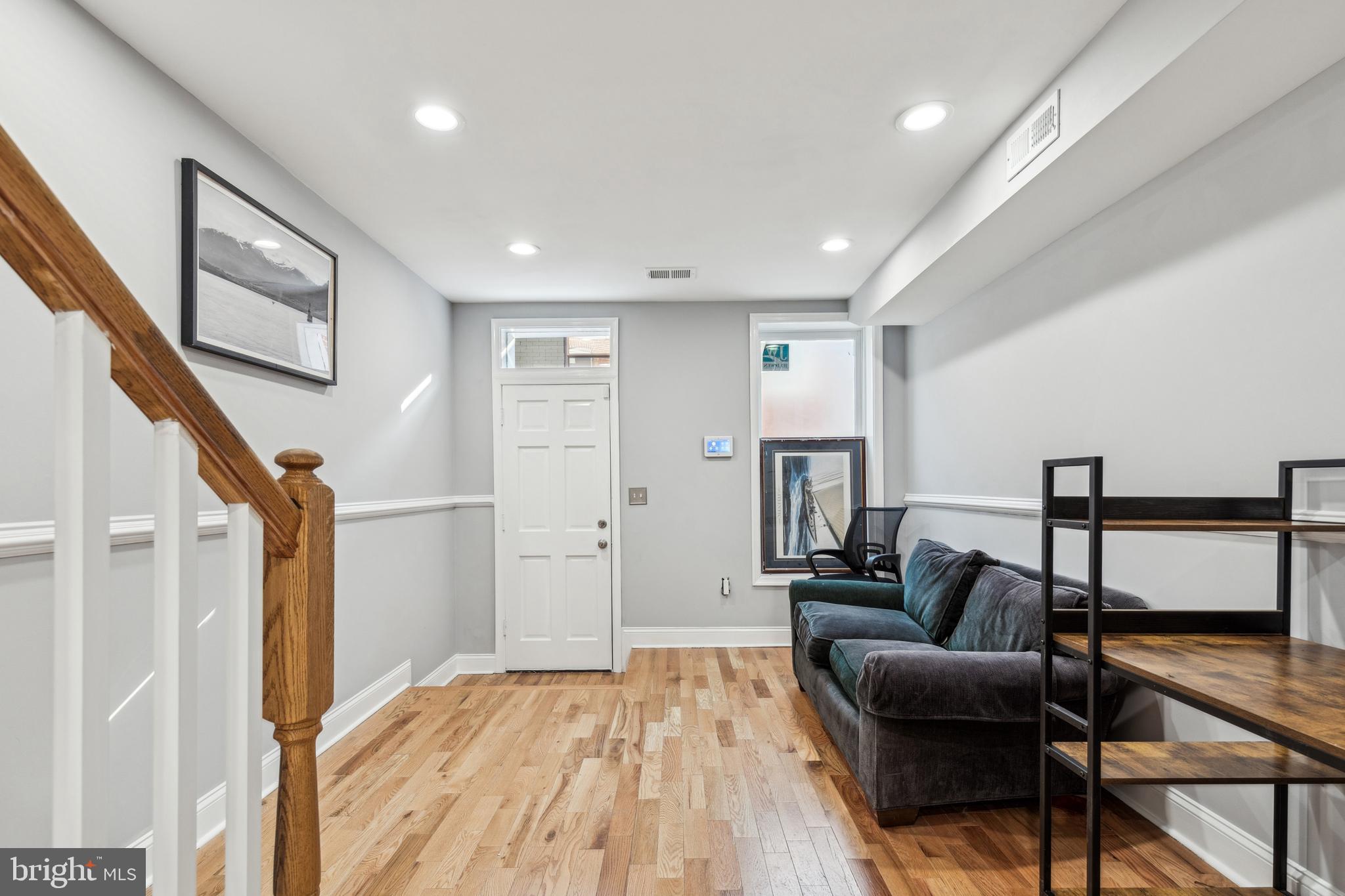 712 North Duncan Street Baltimore, MD 21205 - Photo 7 of 27 a living room with furniture and a wooden floor