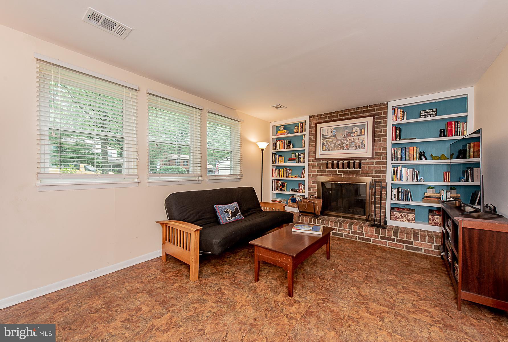 9623 Rocksparkle Row Columbia, MD 21045 - Photo 12 of 20 Family Room Wood-burning FP & Built-in Bookcases