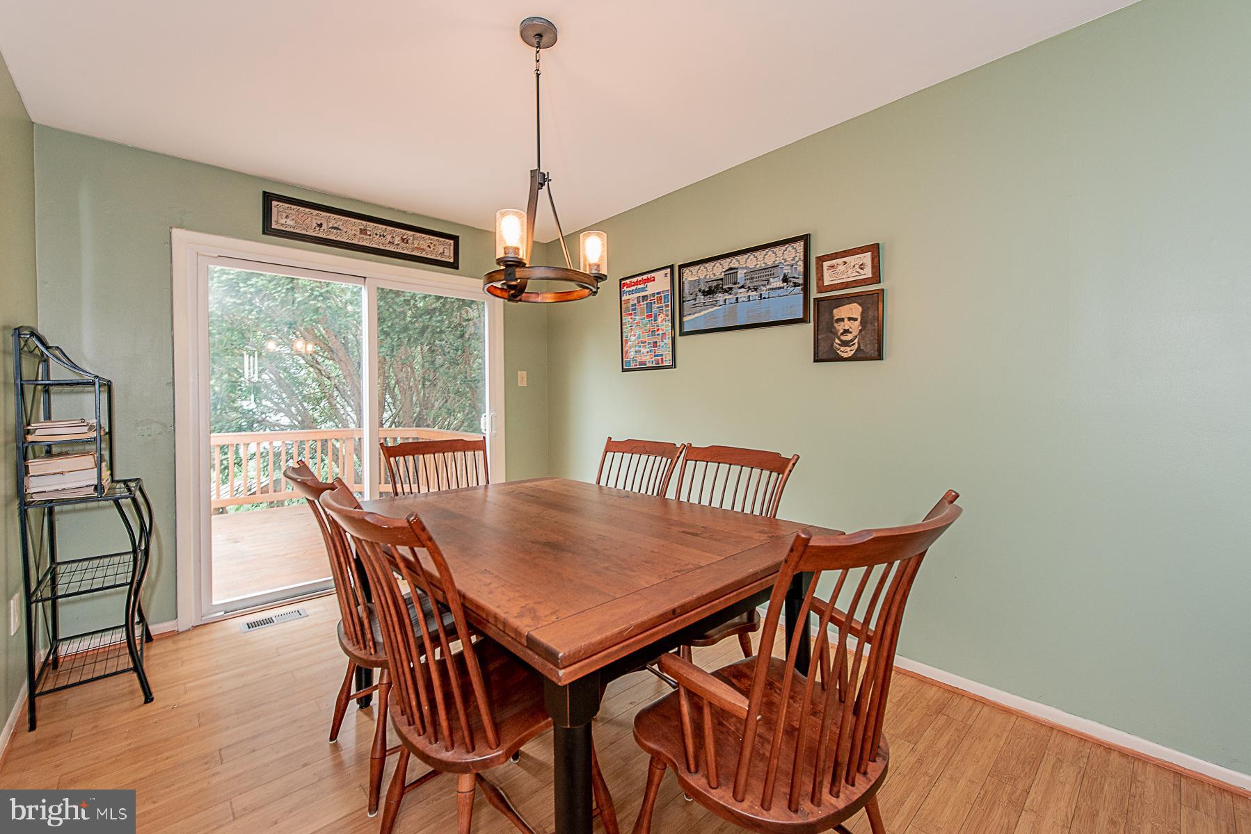 9623 Rocksparkle Row Columbia, MD 21045 - Photo 6 of 20 Separate Dining Room with Slider to Deck & Yard