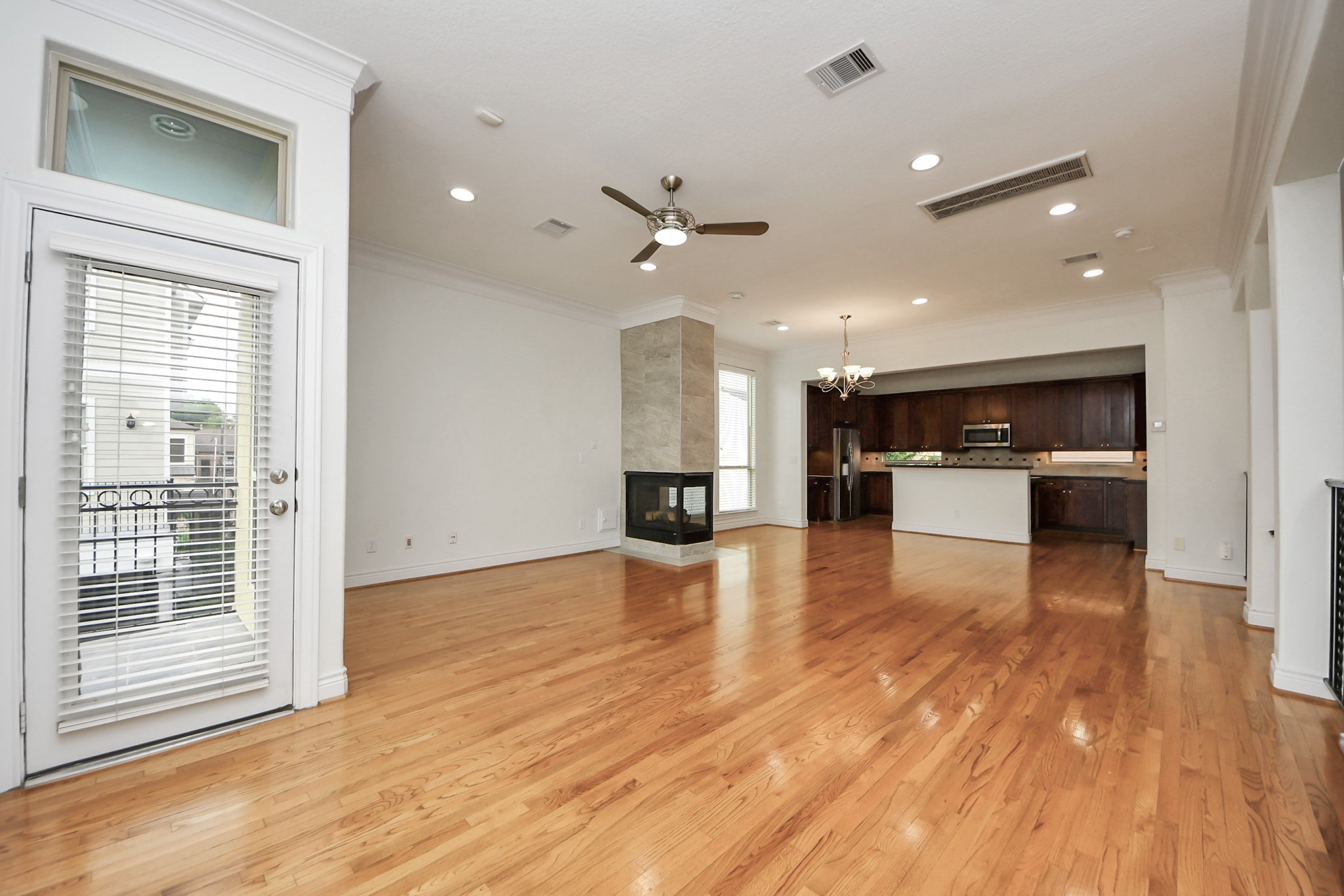 5526 Crooms Street Houston, TX 77007 - Photo 13 of 49 a view of kitchen with cabinets and wooden floor
