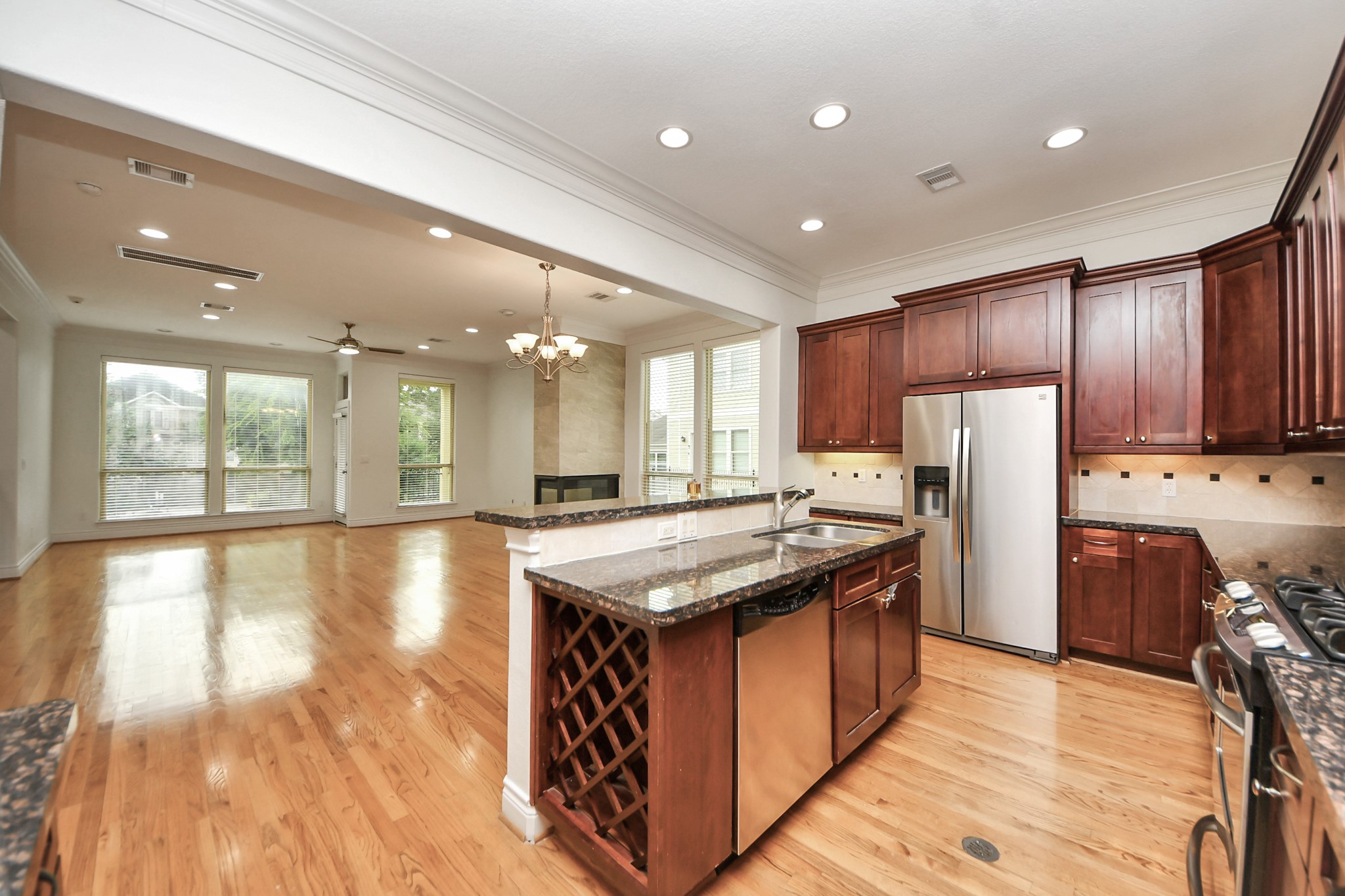 5526 Crooms Street Houston, TX 77007 - Photo 22 of 49 a kitchen with stainless steel appliances granite countertop a stove a refrigerator a sink and a oven