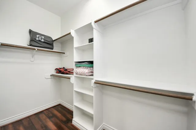 a large white kitchen with a large window