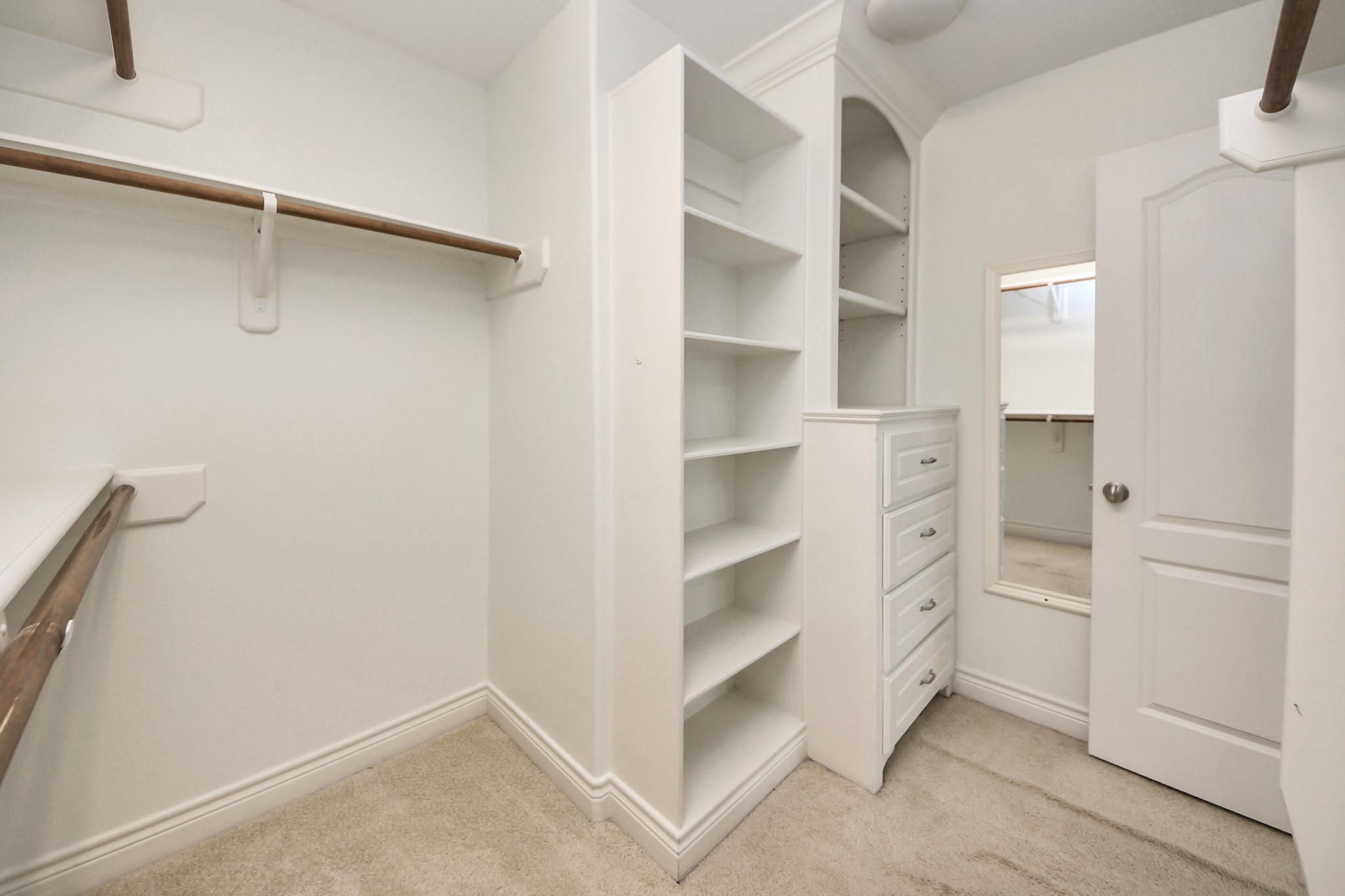 5526 Crooms Street Houston, TX 77007 - Photo 40 of 49 a view of walk in closet with empty racks