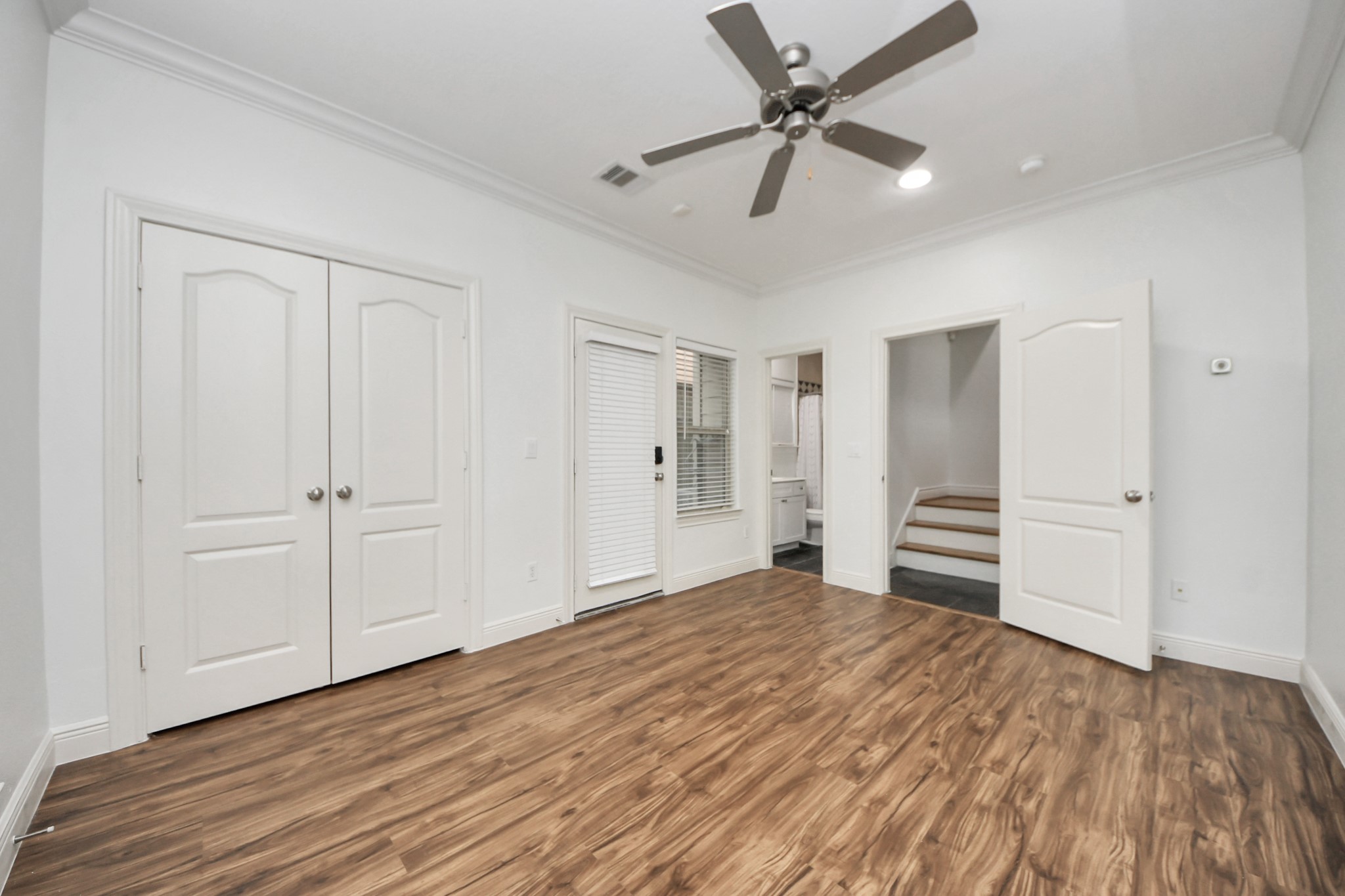 5526 Crooms Street Houston, TX 77007 - Photo 44 of 49 a view of a livingroom with a hardwood floor and ceiling fan
